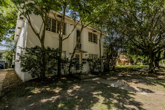a backyard of a house with lots of green space