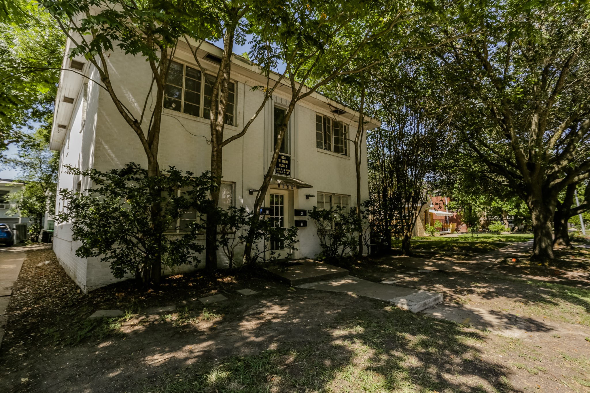 a backyard of a house with lots of green space