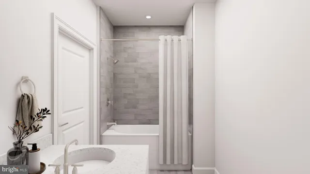 a bathroom with a bathtub and a sink