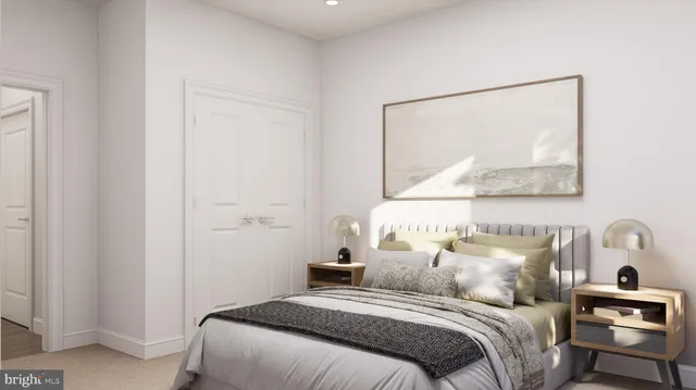 a bedroom with a bed and a painting on the wall