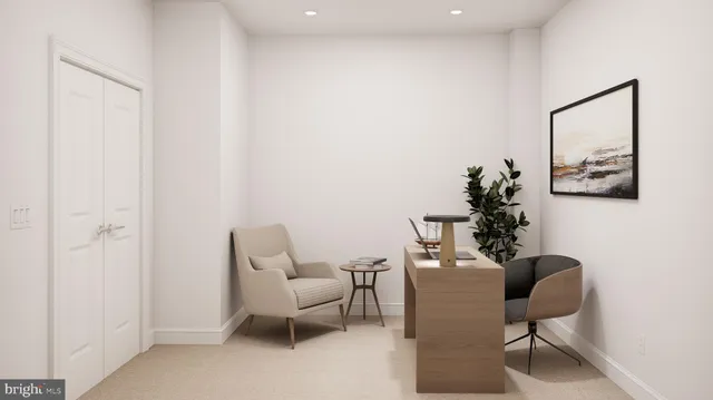 a dining room with furniture and a potted plant