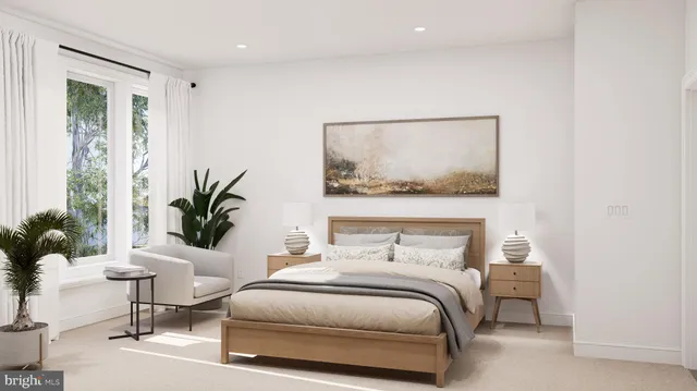 a bedroom with a bed and a potted plant