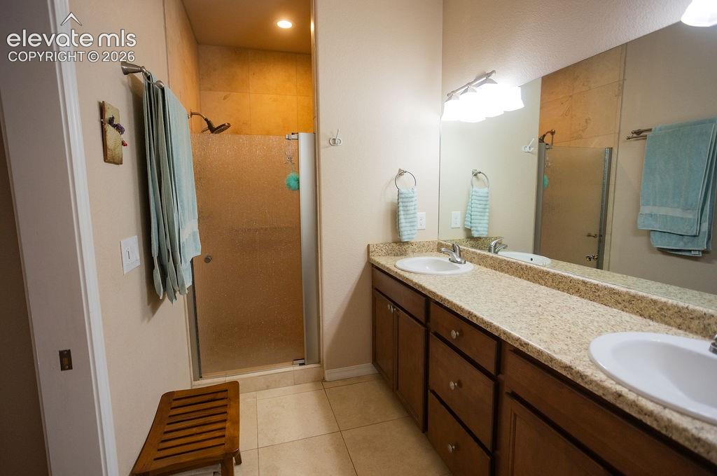 45 Valley Circle Divide, CO 80814 - Photo 13 of 42 a bathroom with a sink double vanity and a mirror