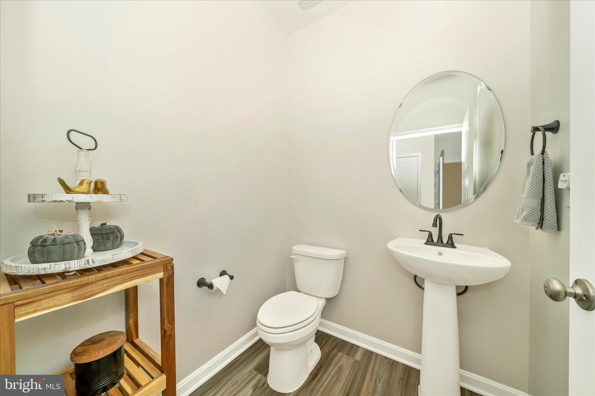 2086 Pomona Way Frederick, MD 21702 - Photo 14 of 77 a bathroom with a toilet sink and mirror