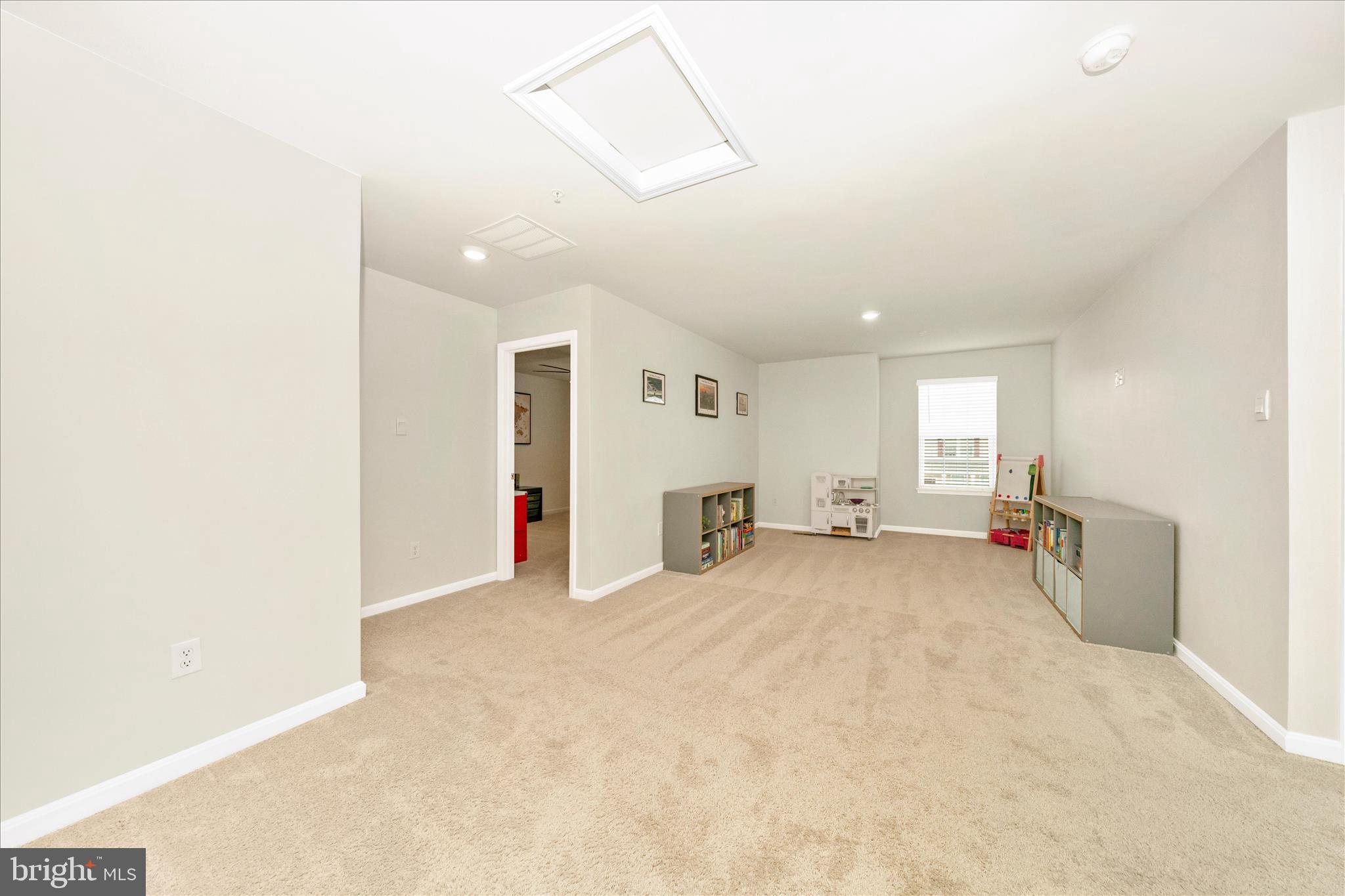 2086 Pomona Way Frederick, MD 21702 - Photo 16 of 77 an empty room with windows and fireplace