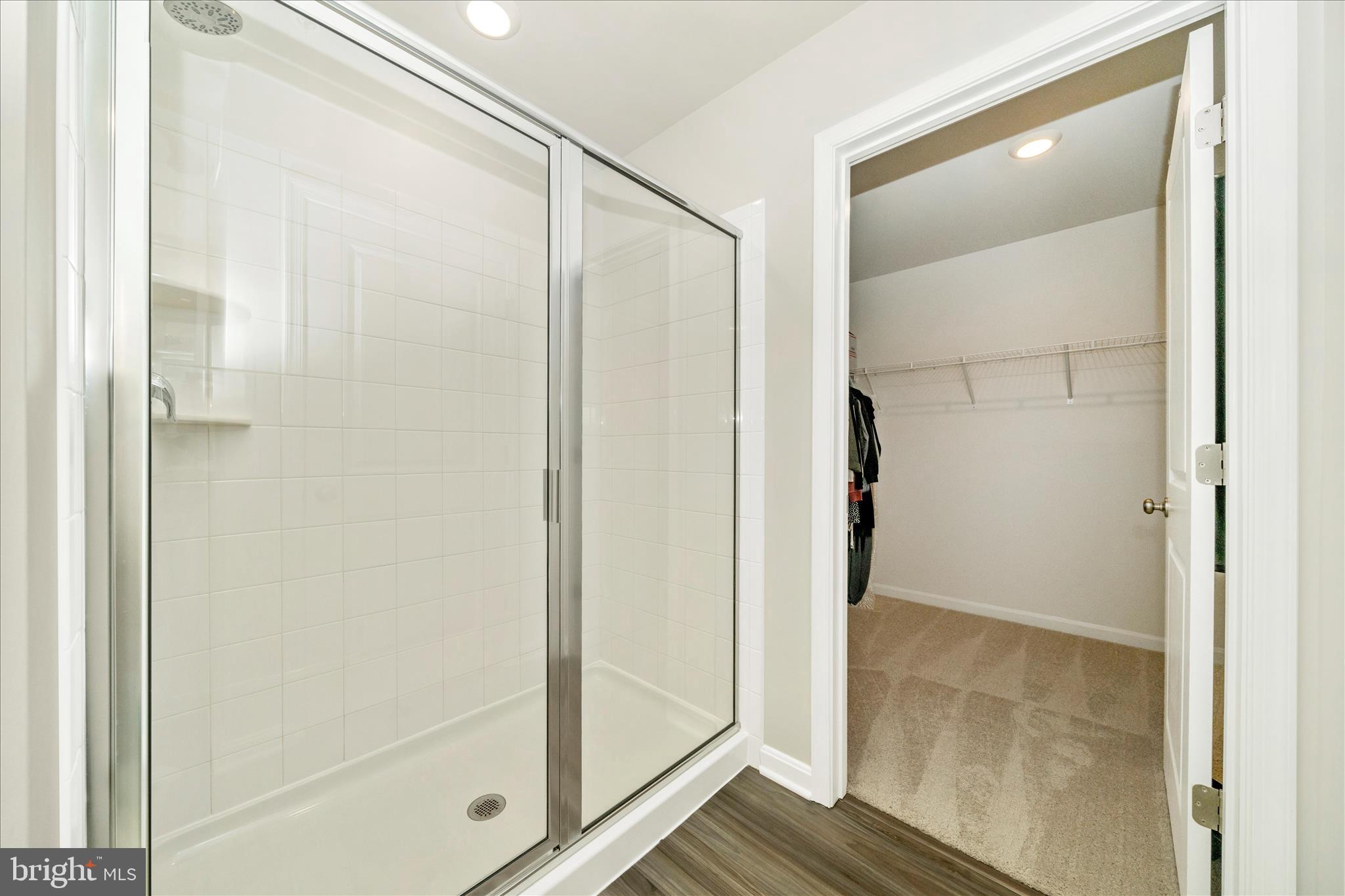 2086 Pomona Way Frederick, MD 21702 - Photo 21 of 77 a bathroom with a glass shower door