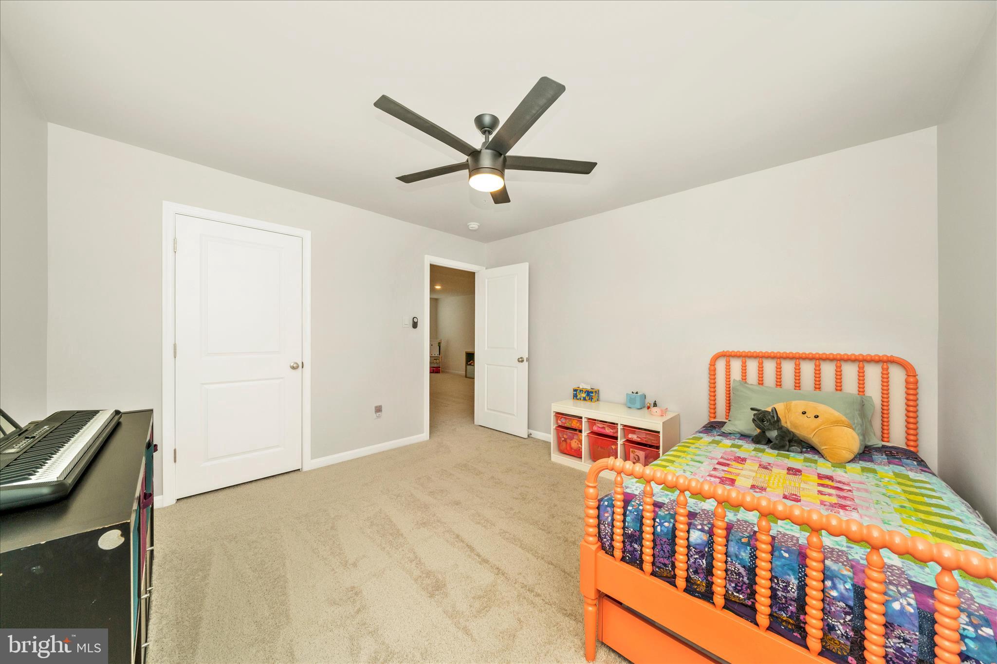 2086 Pomona Way Frederick, MD 21702 - Photo 22 of 77 a bedroom with a bed and a chandelier