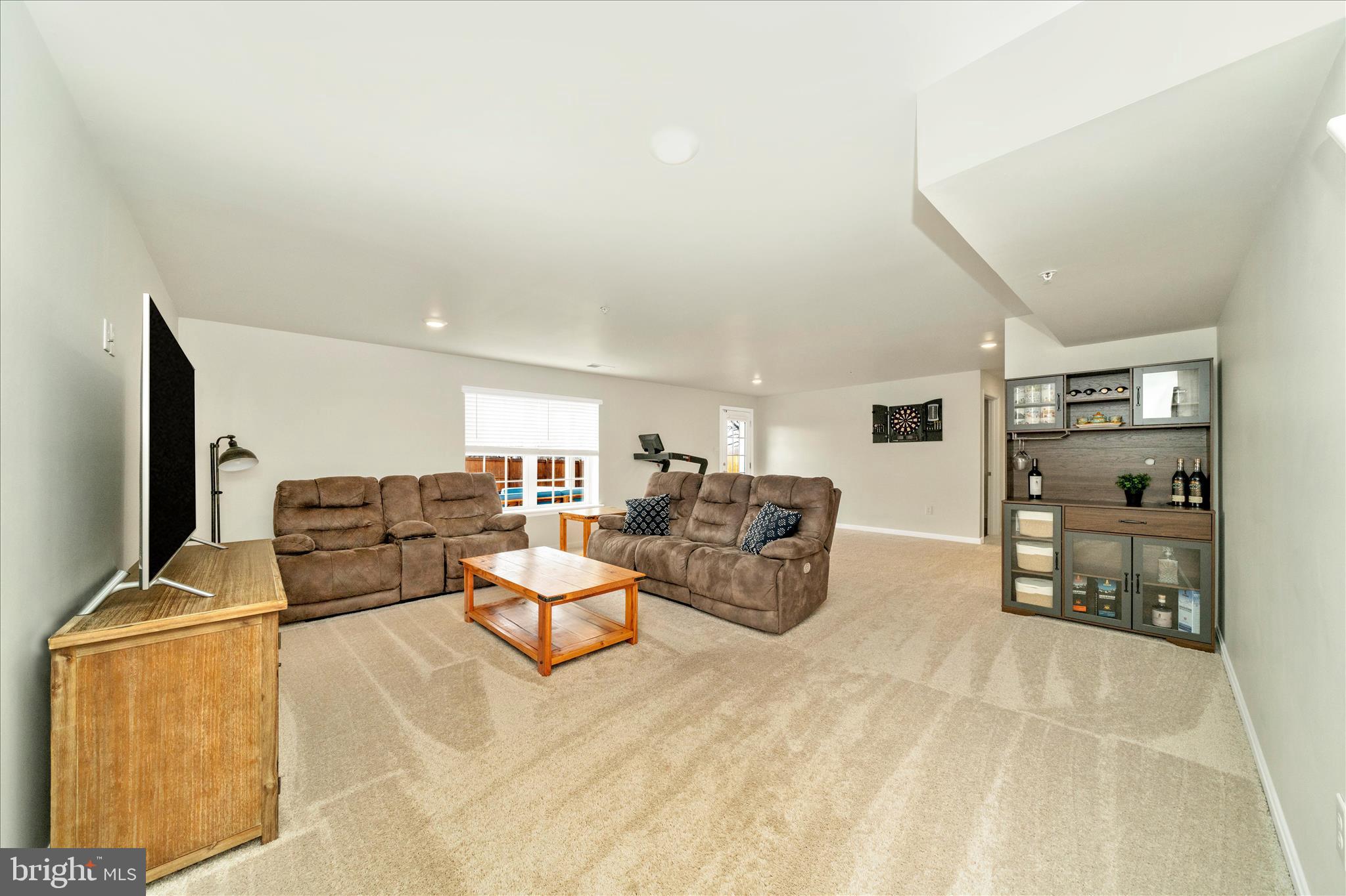 2086 Pomona Way Frederick, MD 21702 - Photo 29 of 77 a living room with furniture flat screen tv and outdoor view
