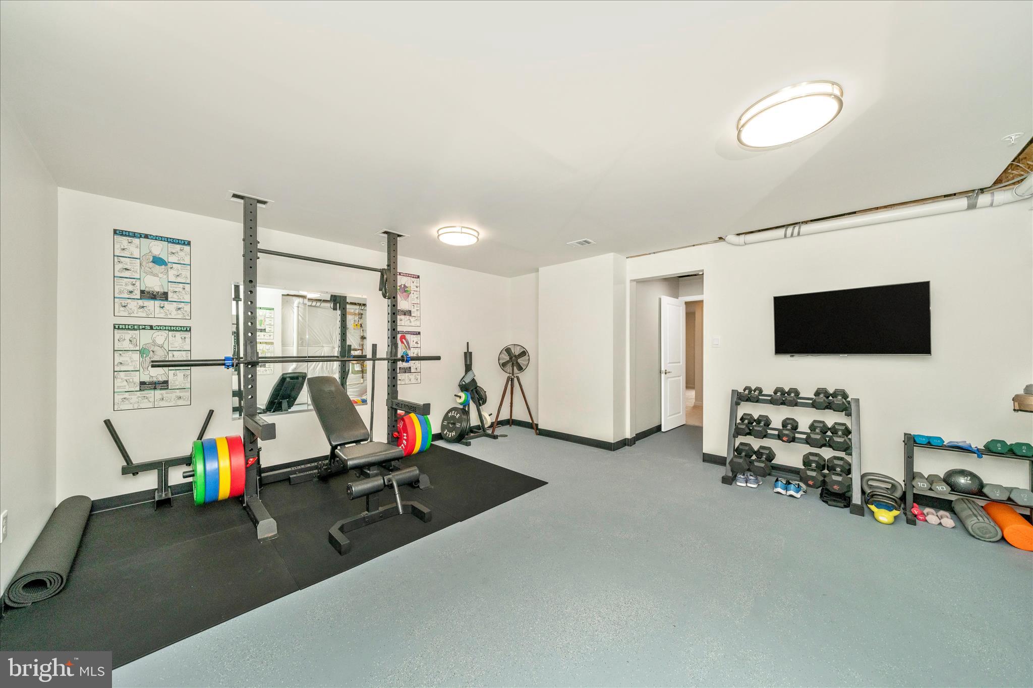 2086 Pomona Way Frederick, MD 21702 - Photo 33 of 77 a room with gym equipment and a flat screen tv
