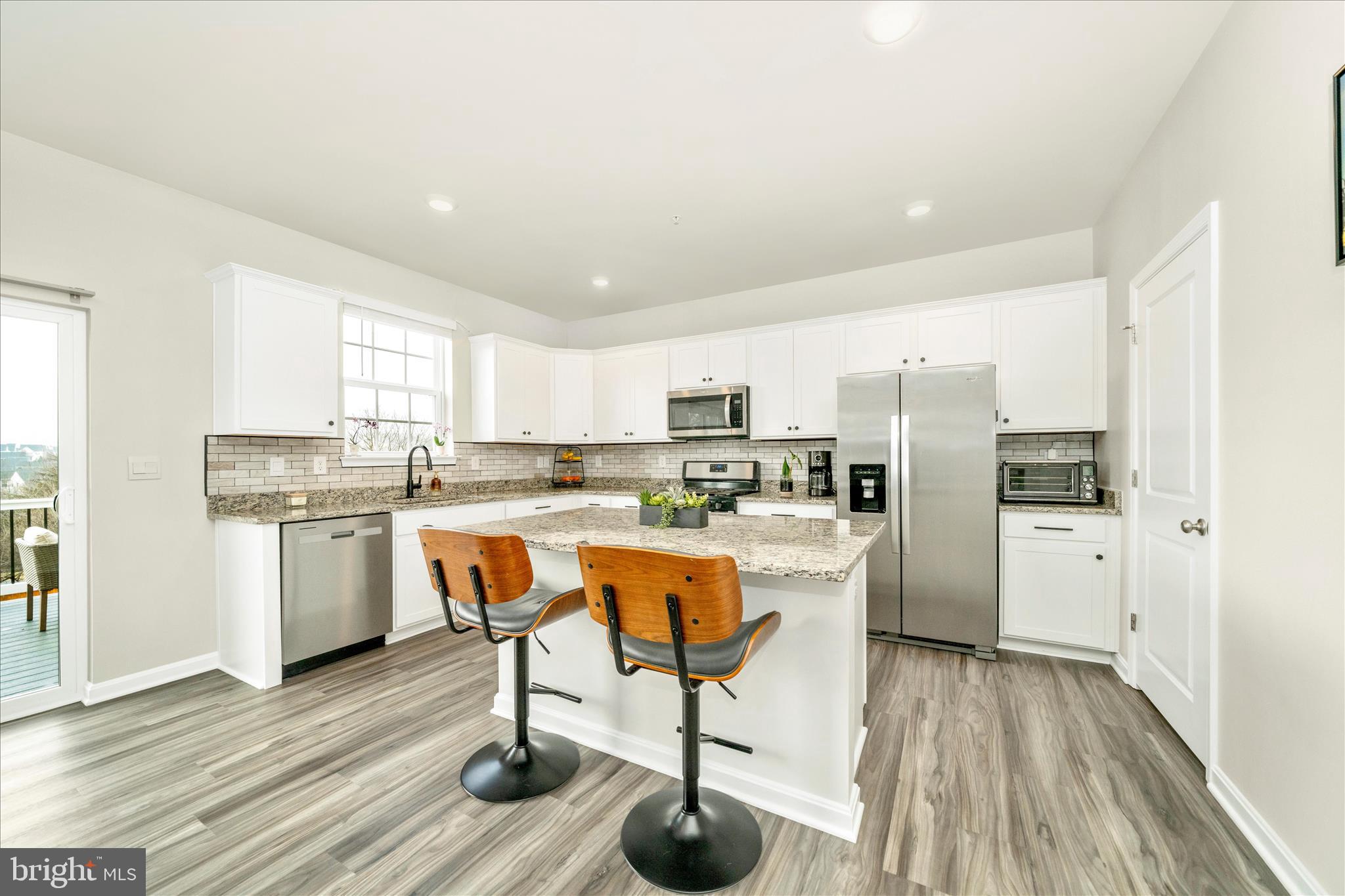 2086 Pomona Way Frederick, MD 21702 - Photo 4 of 77 a kitchen with white cabinets and stainless steel appliances