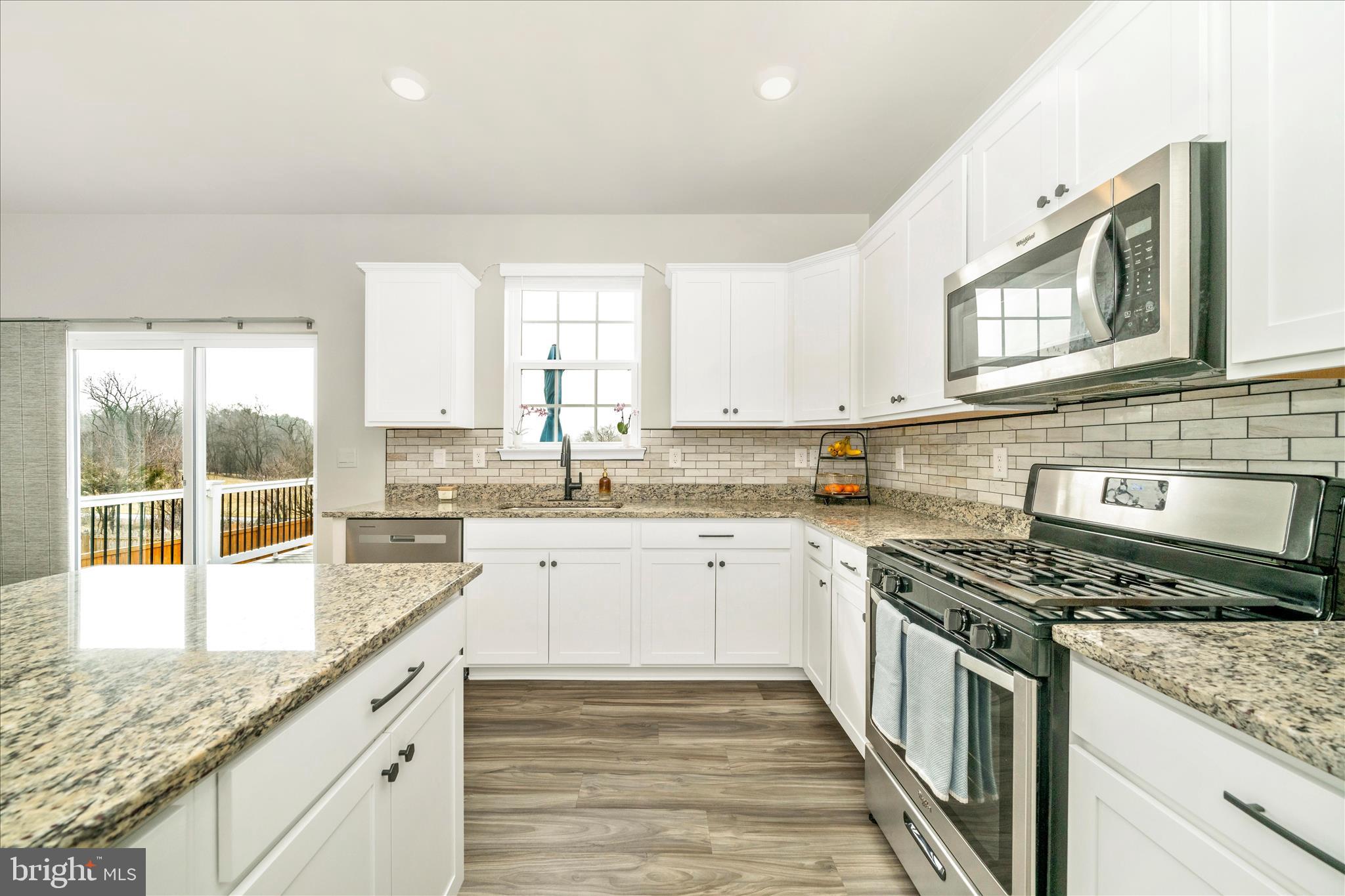 2086 Pomona Way Frederick, MD 21702 - Photo 7 of 77 a kitchen with stainless steel appliances granite countertop a stove sink and cabinets