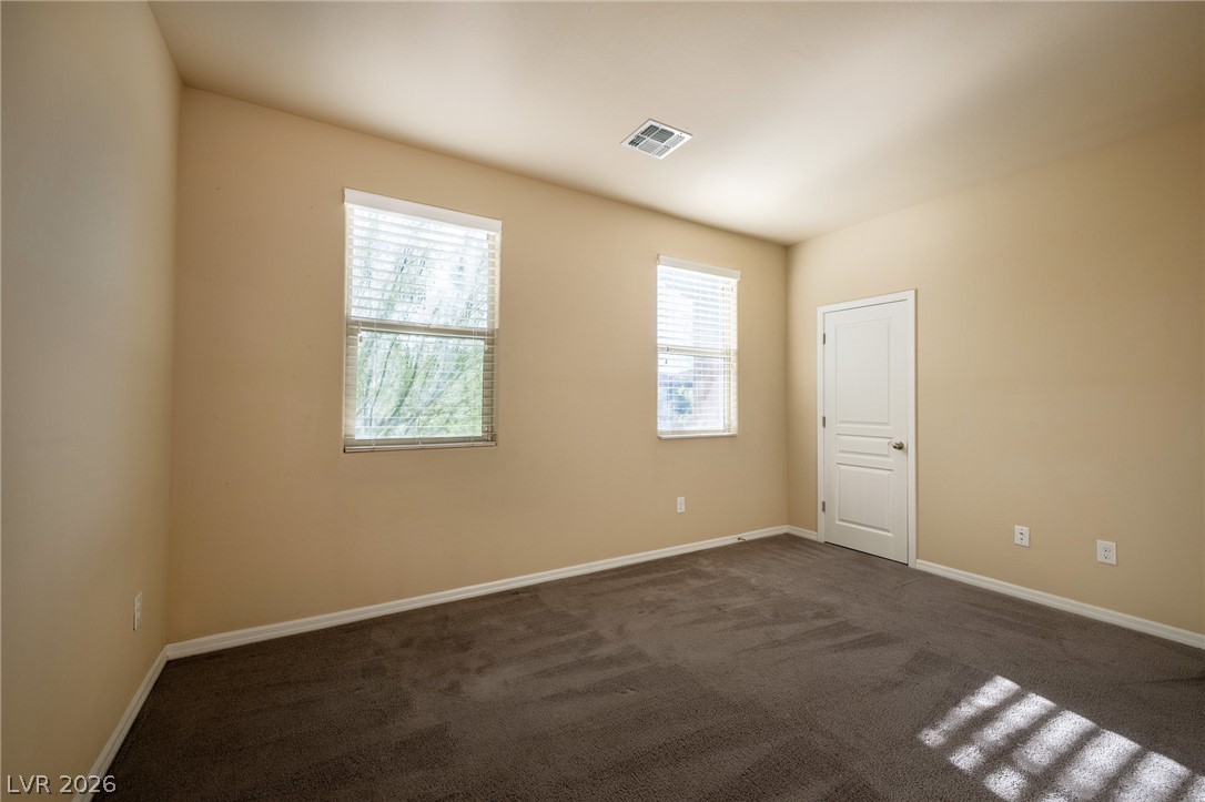 11016 Prairie Grove Road Las Vegas, NV 89179 - Photo 27 of 37 A well-proportioned bedroom offers ample wall space and abundant natural light.