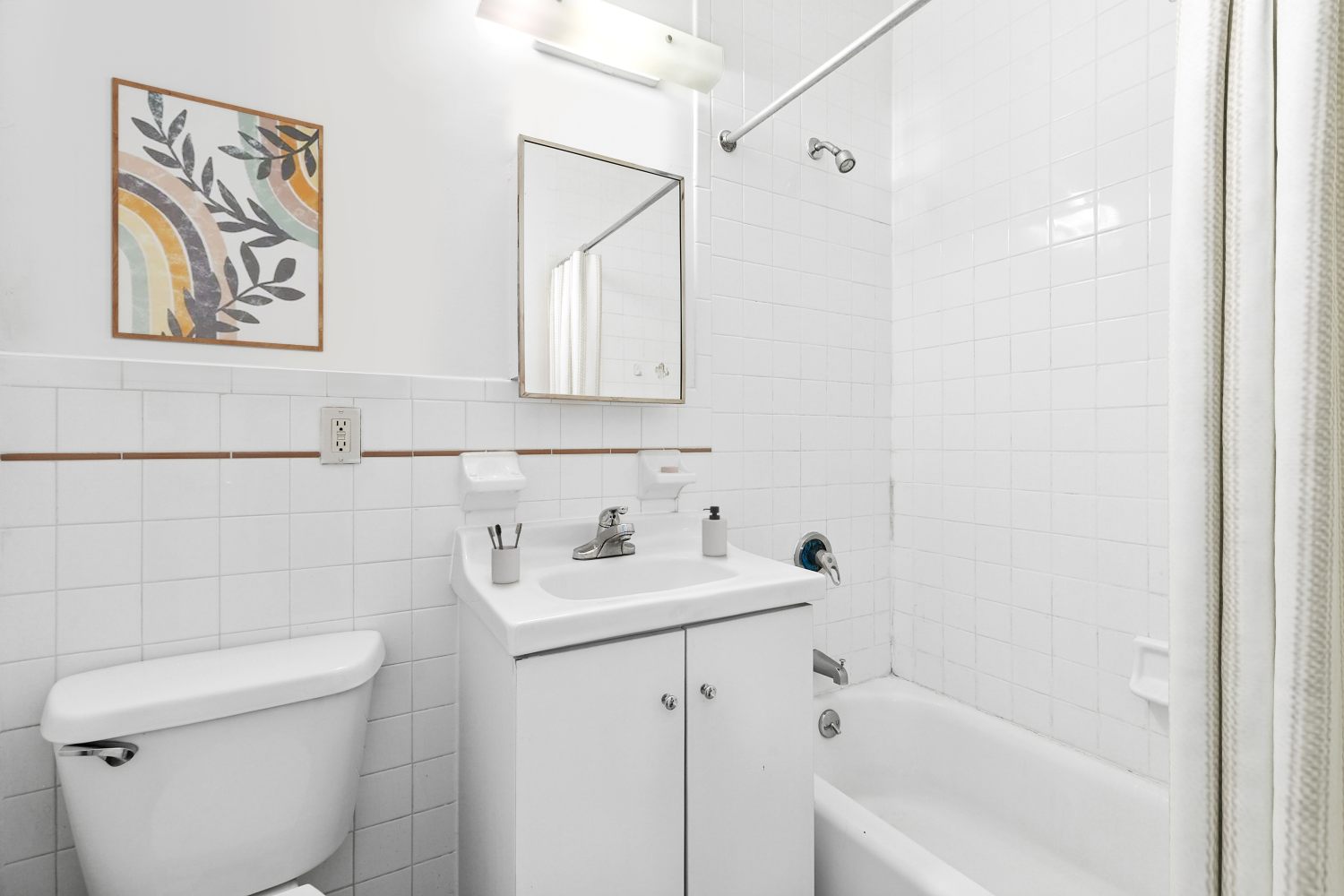 248 East 3rd Street, Unit 3B Manhattan, NY 10009 - Photo 9 of 11 a bathroom with a sink a toilet and shower