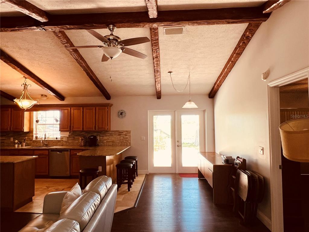 7961 West Riverbend Road Crystal River, FL 34428 - Photo 12 of 40 a kitchen with a sink a stove and wooden floors