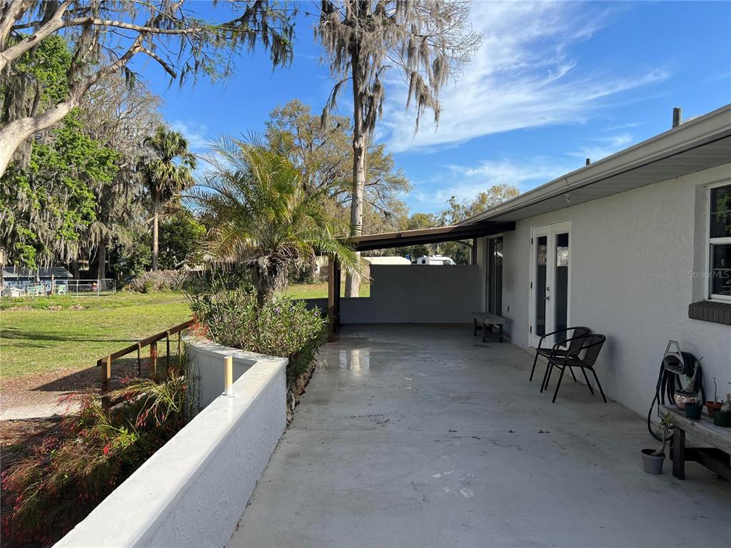 7961 West Riverbend Road Crystal River, FL 34428 - Photo 33 of 40 a view of backyard with swimming pool and outdoor seating