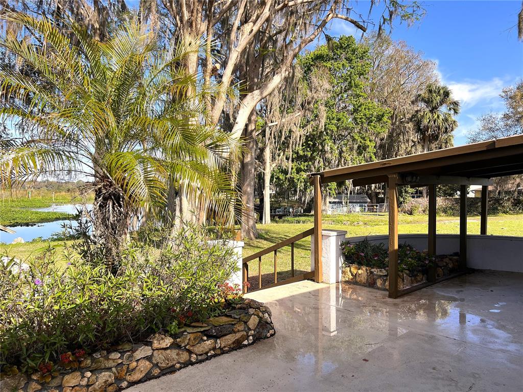 7961 West Riverbend Road Crystal River, FL 34428 - Photo 4 of 40 a view of a porch with furniture and a yard
