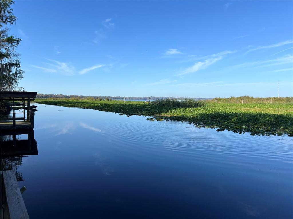 7961 West Riverbend Road Crystal River, FL 34428 - Photo 9 of 40 a view of a lake with houses in the background