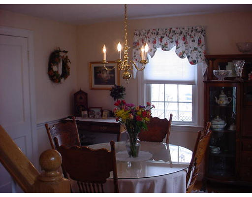 69 Felch Road Natick, MA 01760 - Photo 2 of 5 a living room with furniture and a chandelier