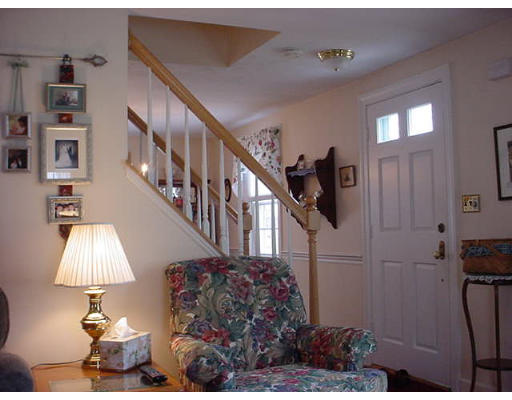 69 Felch Road Natick, MA 01760 - Photo 3 of 5 a view of entryway and hall with wooden floor