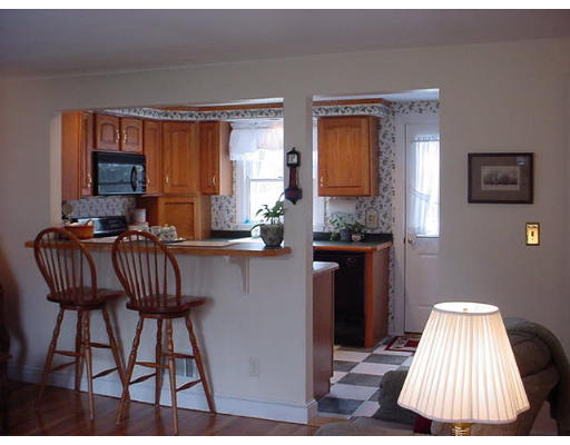 69 Felch Road Natick, MA 01760 - Photo 4 of 5 a view of kitchen with granite countertop furniture and a wooden floor