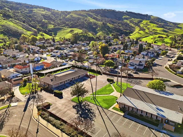 a view of a houses with a mountain