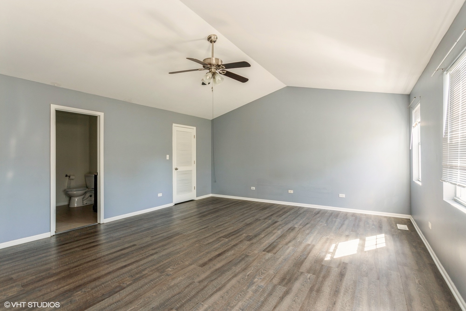 3022 Anton Drive Aurora, IL 60504 - Photo 10 of 15 a view of an empty room with wooden floor and a window