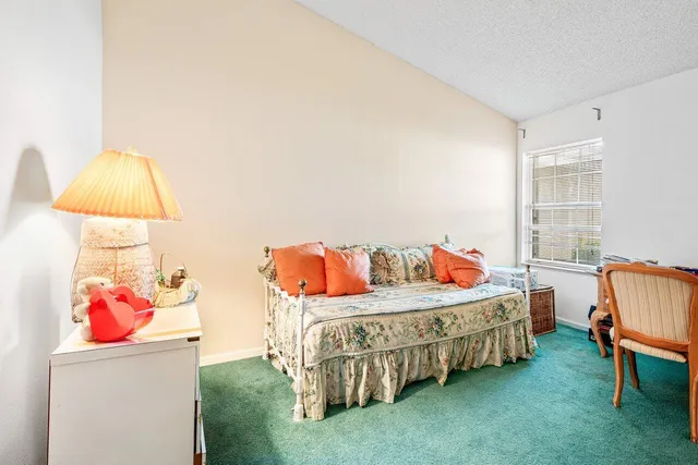 a bedroom with furniture and a bed