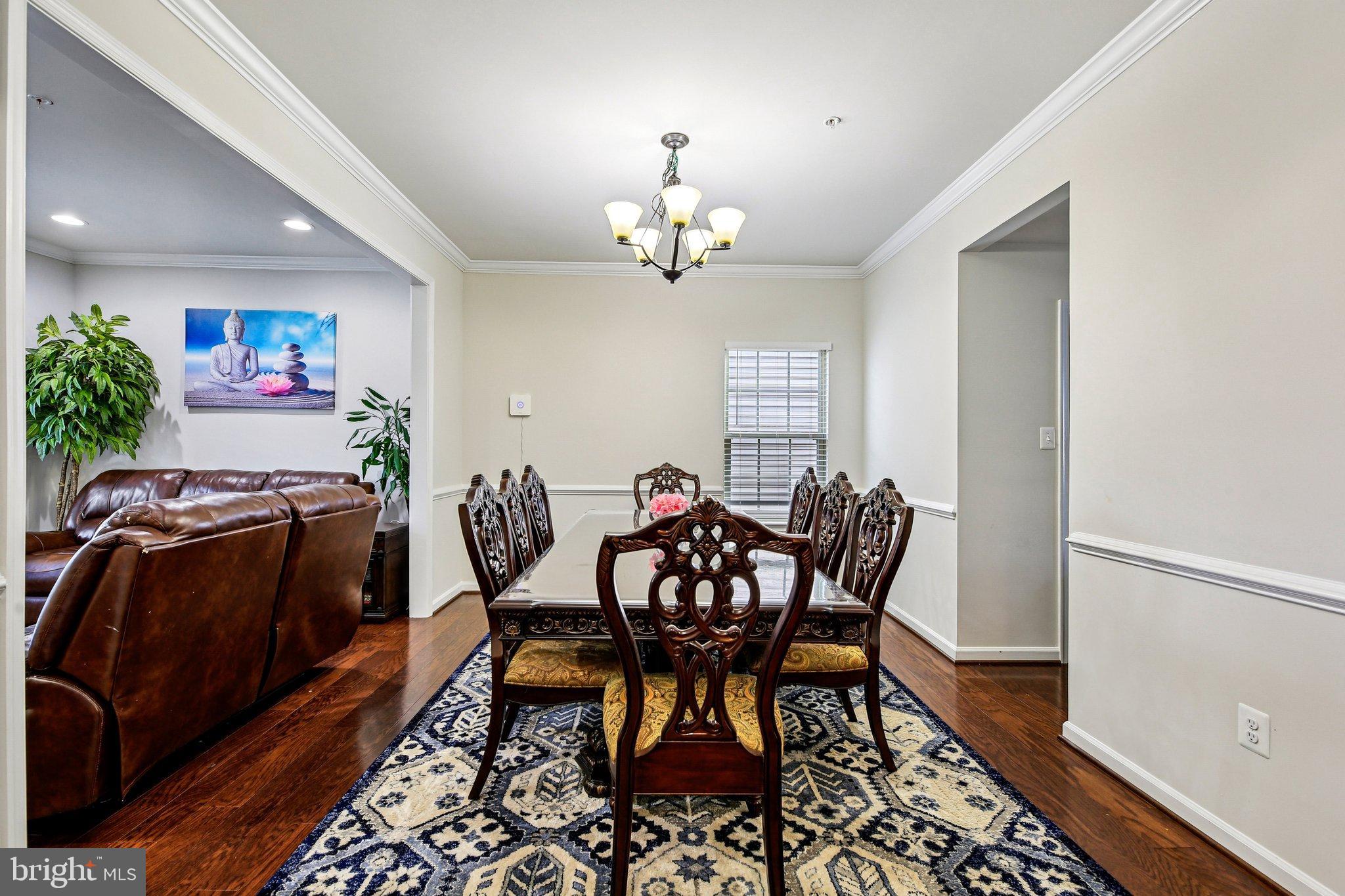 5940 Duvel Street Ijamsville, MD 21754 - Photo 11 of 62 a view of a dining room with furniture window and wooden floor
