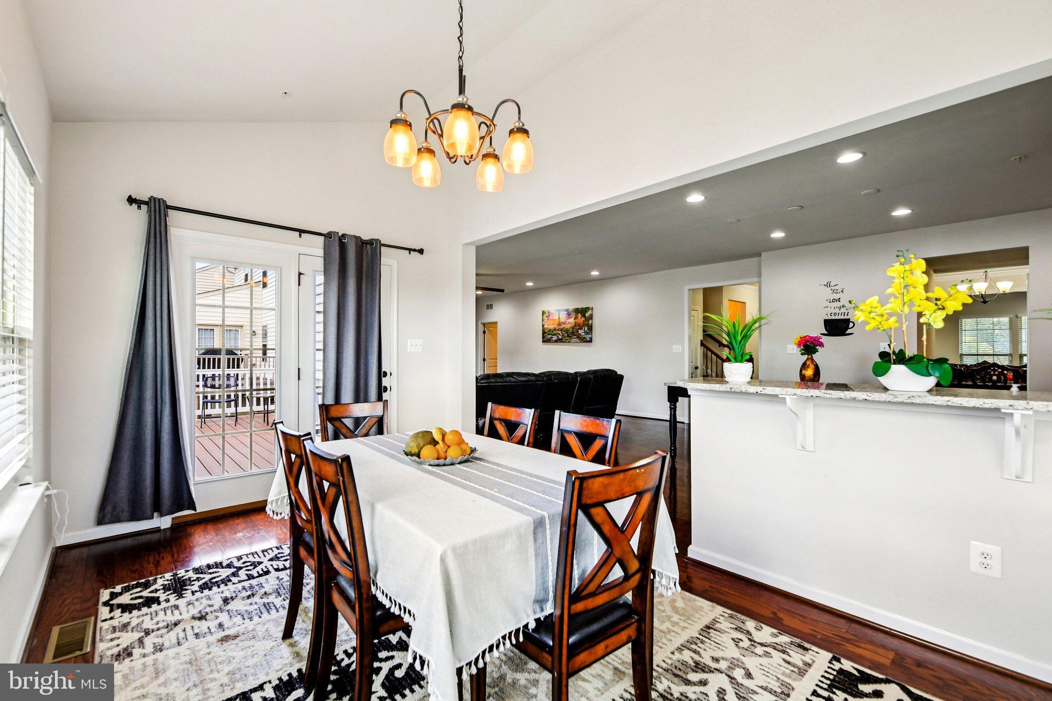 5940 Duvel Street Ijamsville, MD 21754 - Photo 14 of 62 a view of a dining room with furniture window and wooden floor