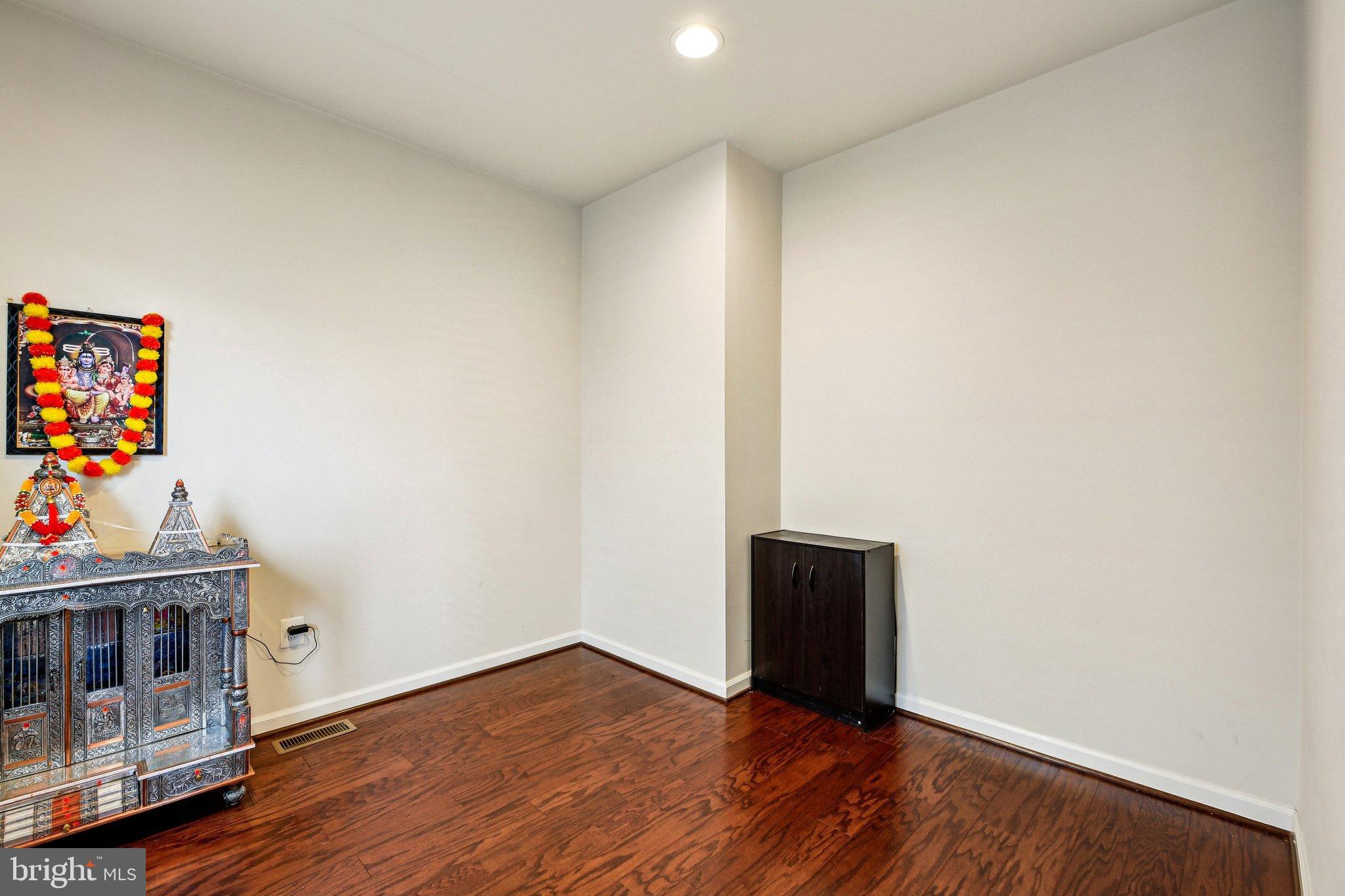 5940 Duvel Street Ijamsville, MD 21754 - Photo 22 of 62 a view of an empty room with wooden floor