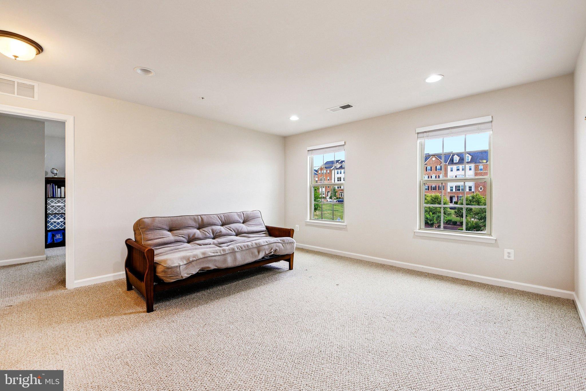 5940 Duvel Street Ijamsville, MD 21754 - Photo 24 of 62 a living room with furniture and a window