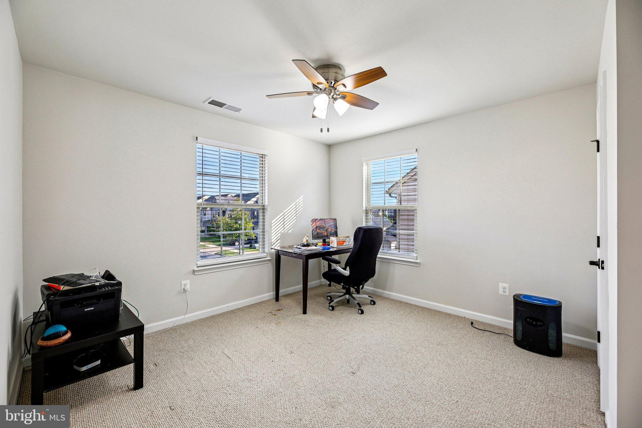 5940 Duvel Street Ijamsville, MD 21754 - Photo 29 of 62 a view of a workspace with furniture and a window