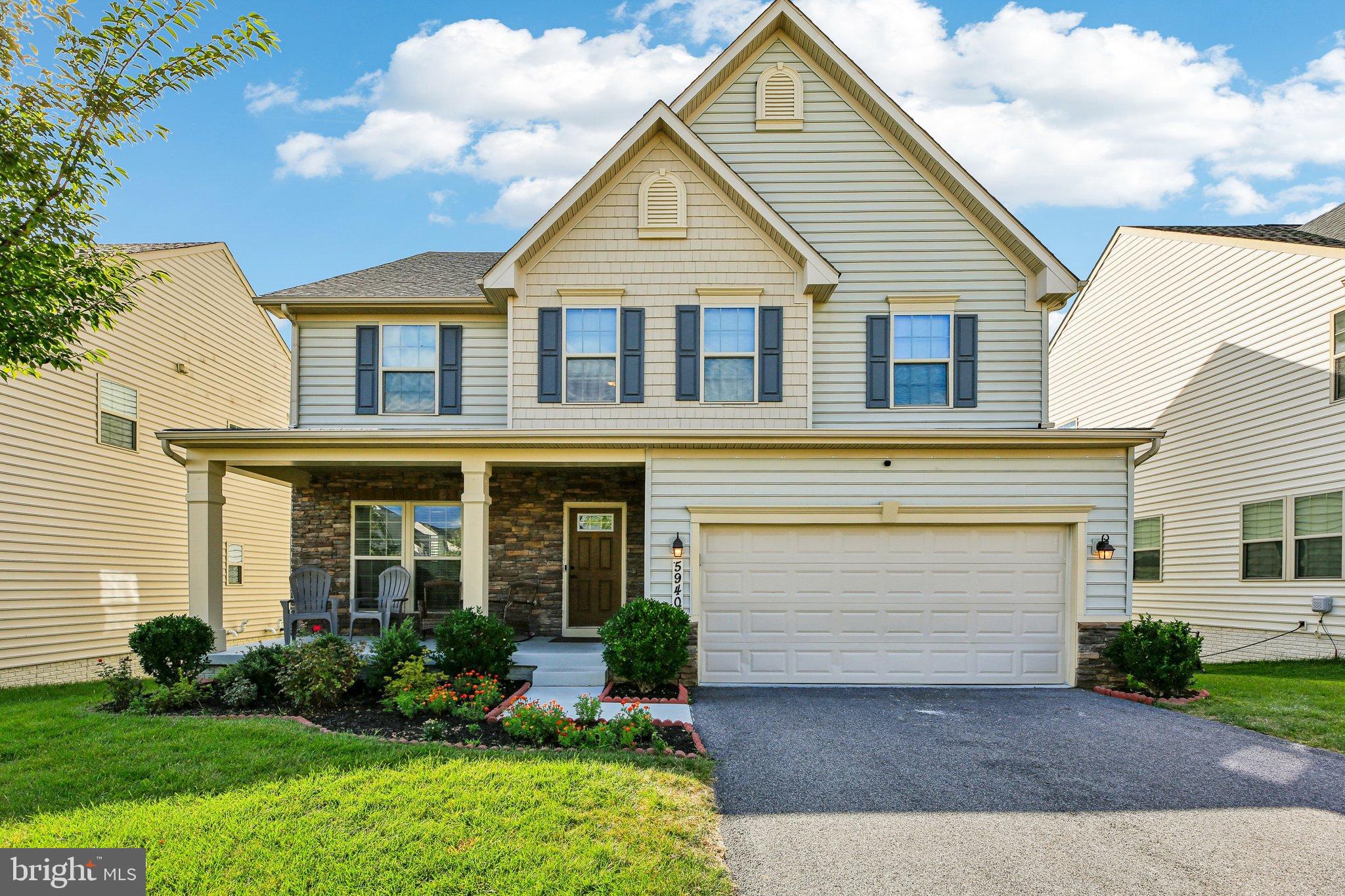 5940 Duvel Street Ijamsville, MD 21754 - Photo 3 of 62 a front view of a house with garden