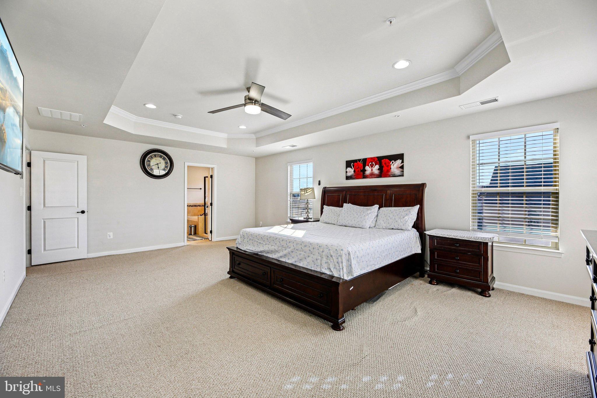 5940 Duvel Street Ijamsville, MD 21754 - Photo 35 of 62 a bedroom with a bed and a chandelier