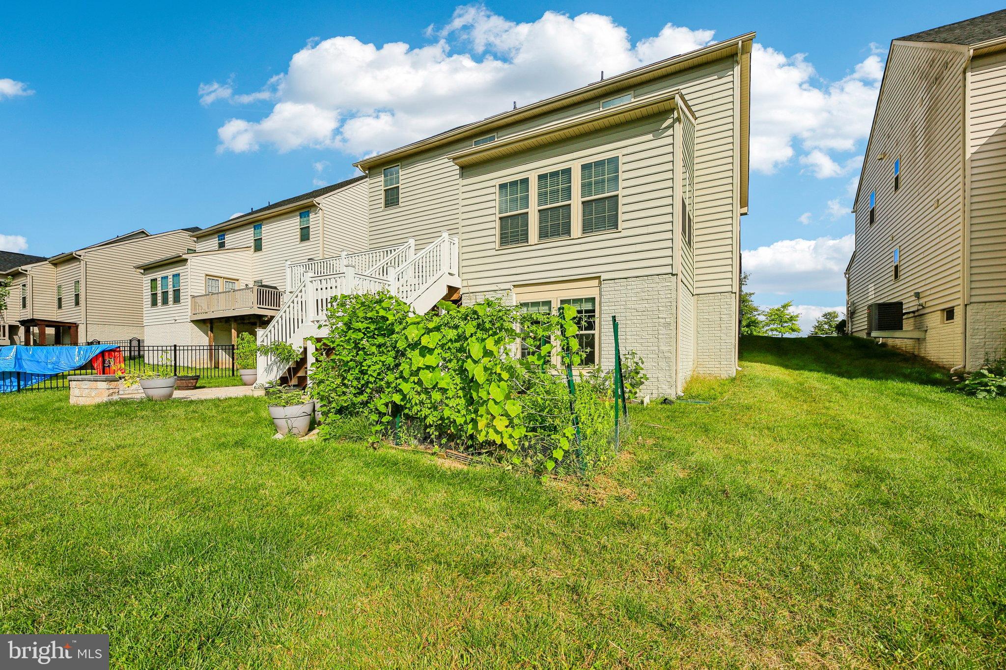 5940 Duvel Street Ijamsville, MD 21754 - Photo 48 of 62 Charming backyard with lush greenery.