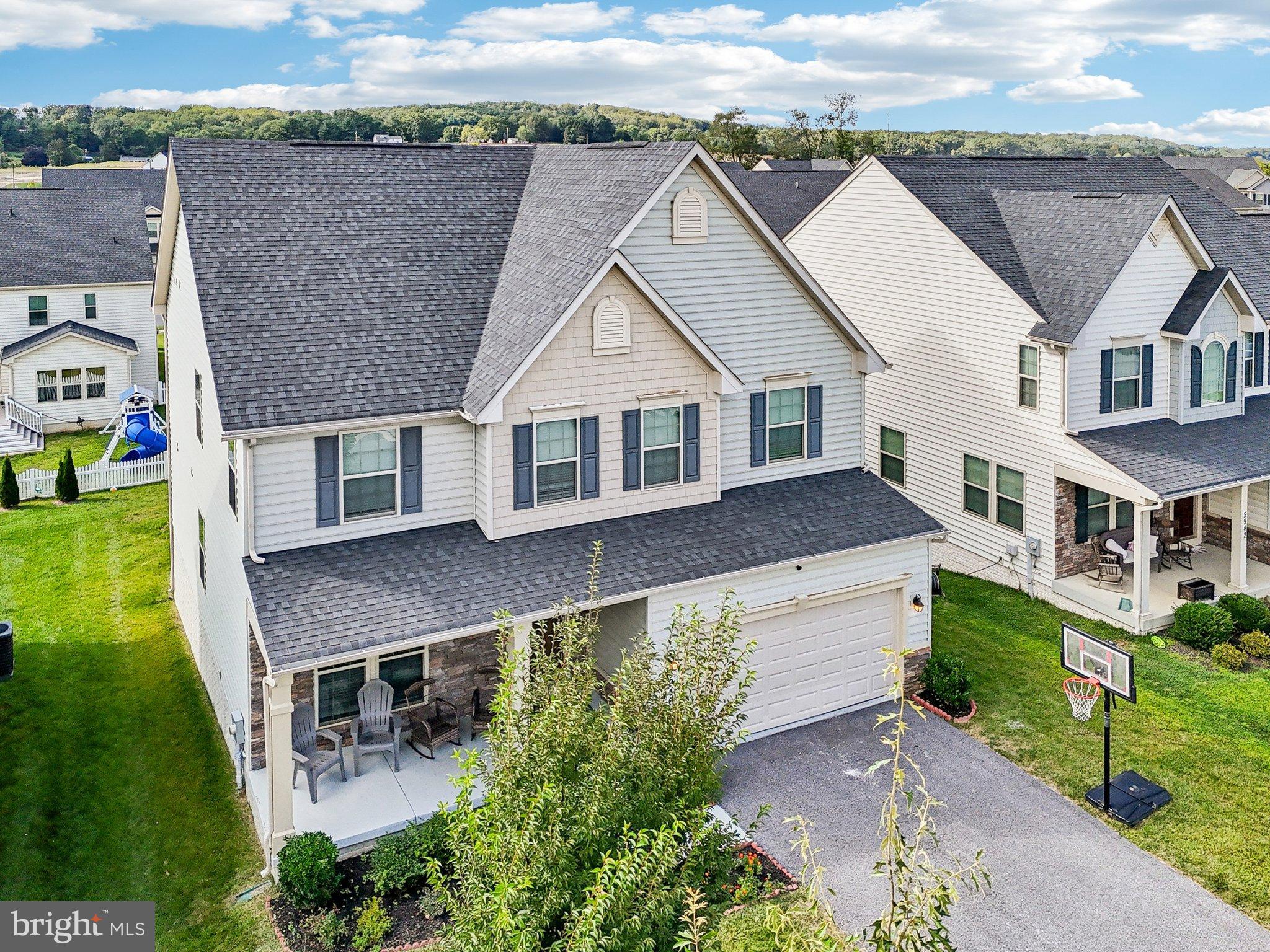 5940 Duvel Street Ijamsville, MD 21754 - Photo 53 of 62 an aerial view of a house with a yard table and chairs