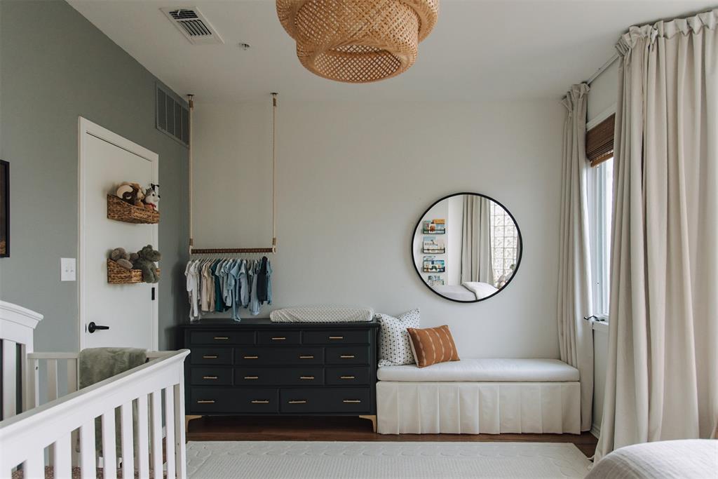 4040 Avondale Avenue, Unit 107 Dallas, TX 75219 - Photo 13 of 33 a living room with furniture a mirror and a window