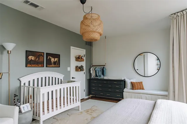 a bed room with furniture and a window