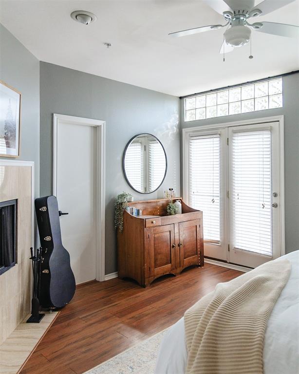 4040 Avondale Avenue, Unit 107 Dallas, TX 75219 - Photo 17 of 33 a bedroom with a bed and a chandelier