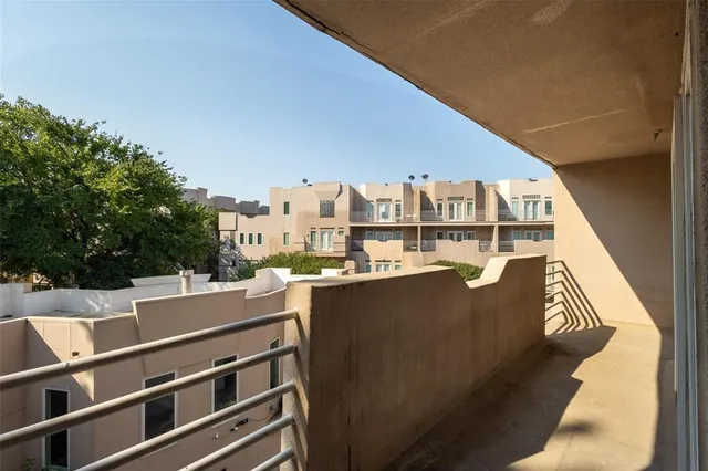 a view of a balcony with chairs