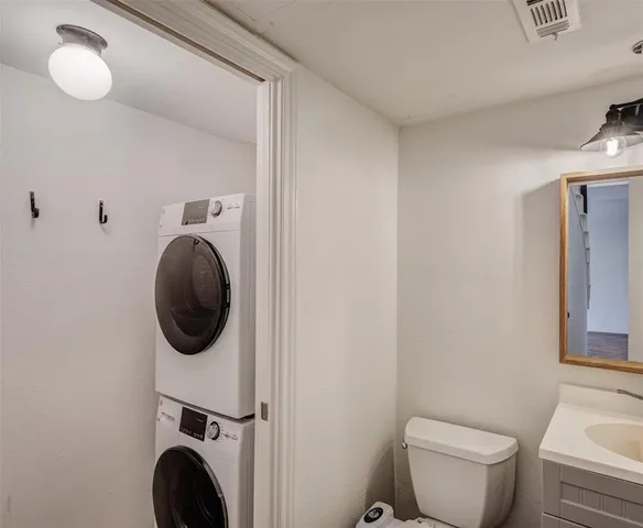 a bathroom with a toilet and a sink