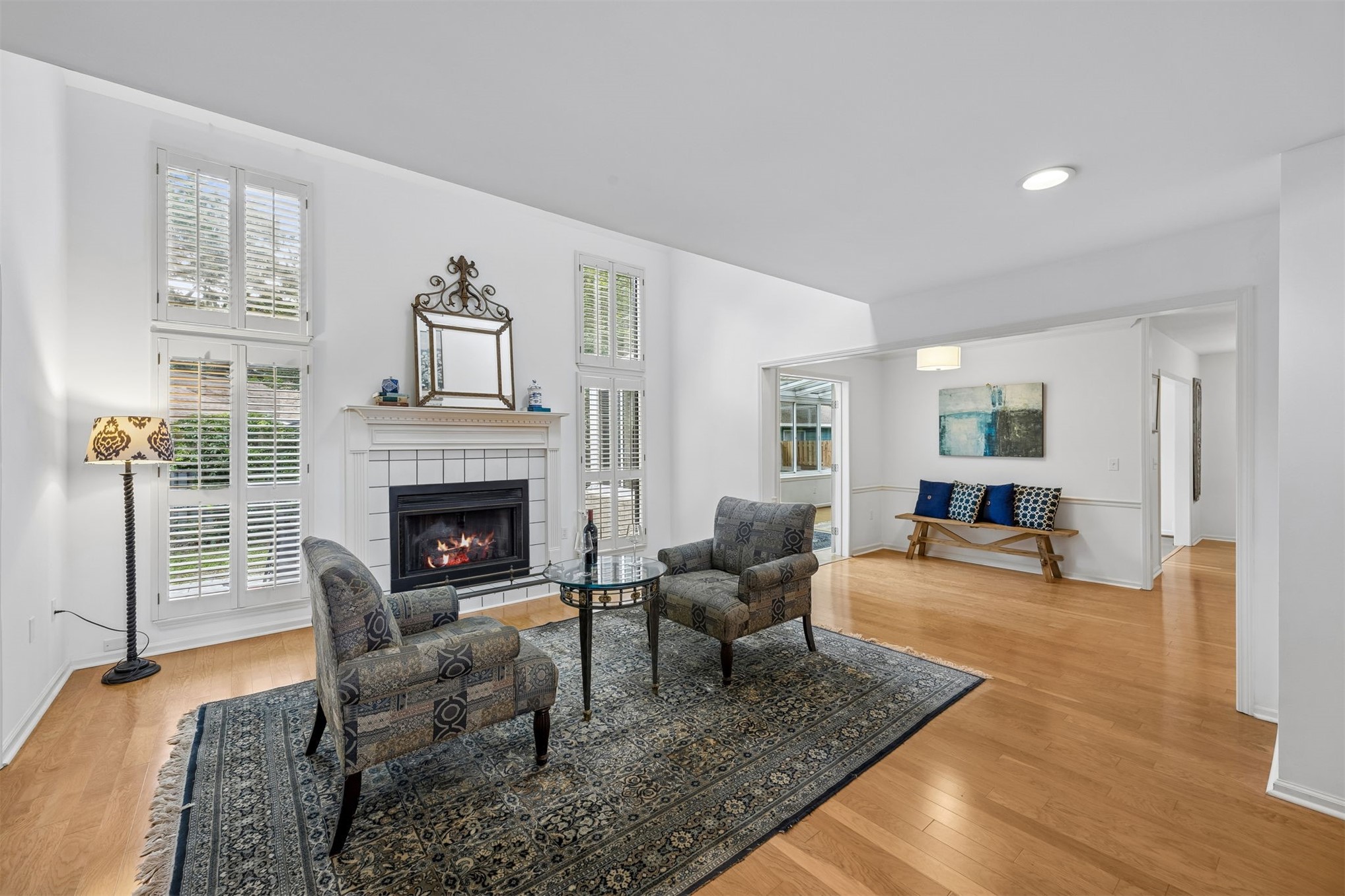 3110 Egans Bluff Road Fernandina Beach, FL 32034 - Photo 3 of 26 The living room is filled with light from windows that flank the fireplace.