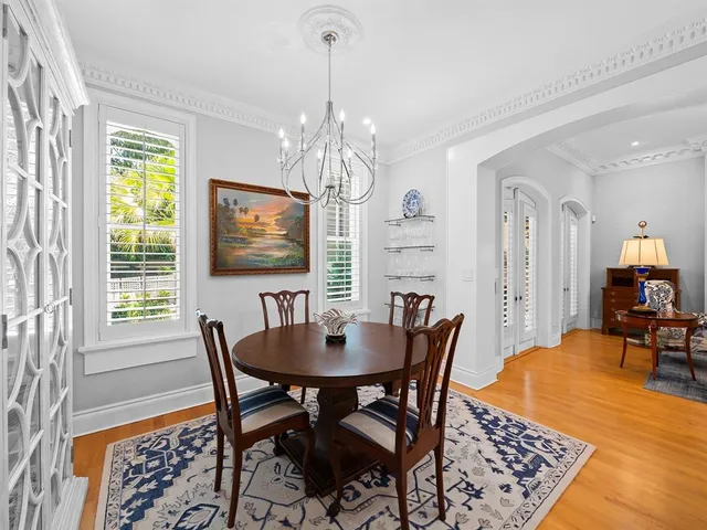 a living room with furniture fireplace and a window