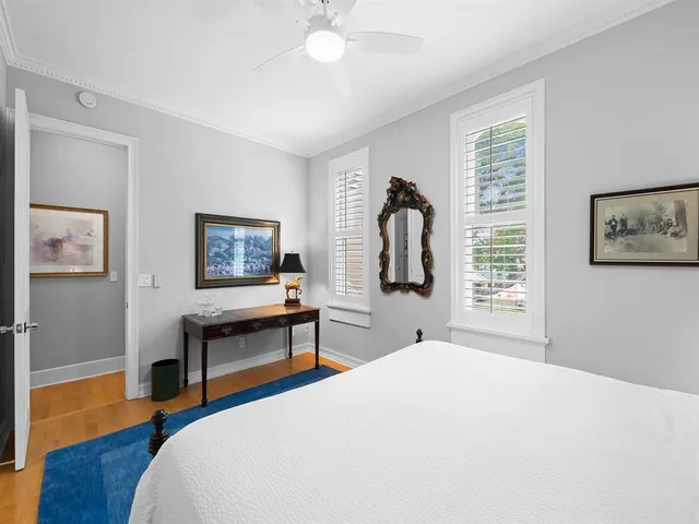 a bedroom with bed and window