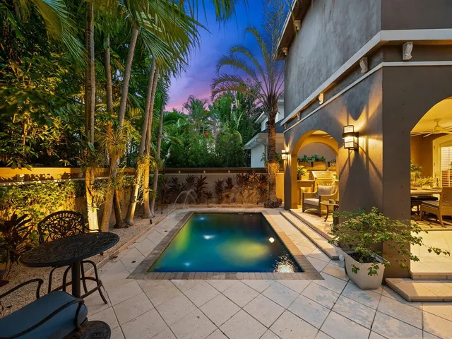 a view of a swimming pool with a patio