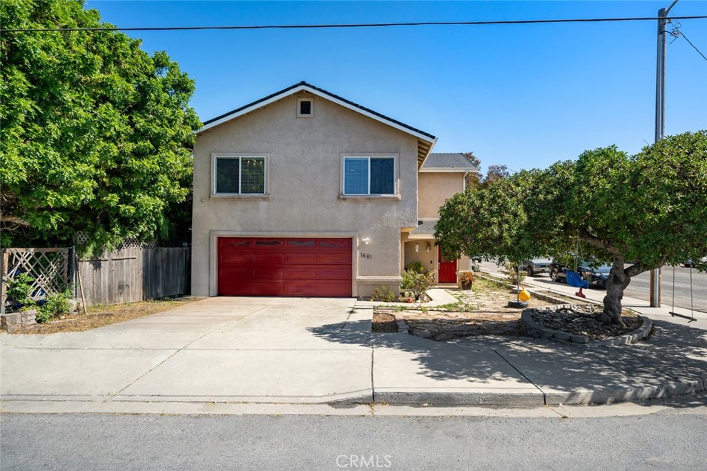 1681 Ocean Street Oceano, CA 93445 - Photo 1 of 25 a front view of a house with a garage
