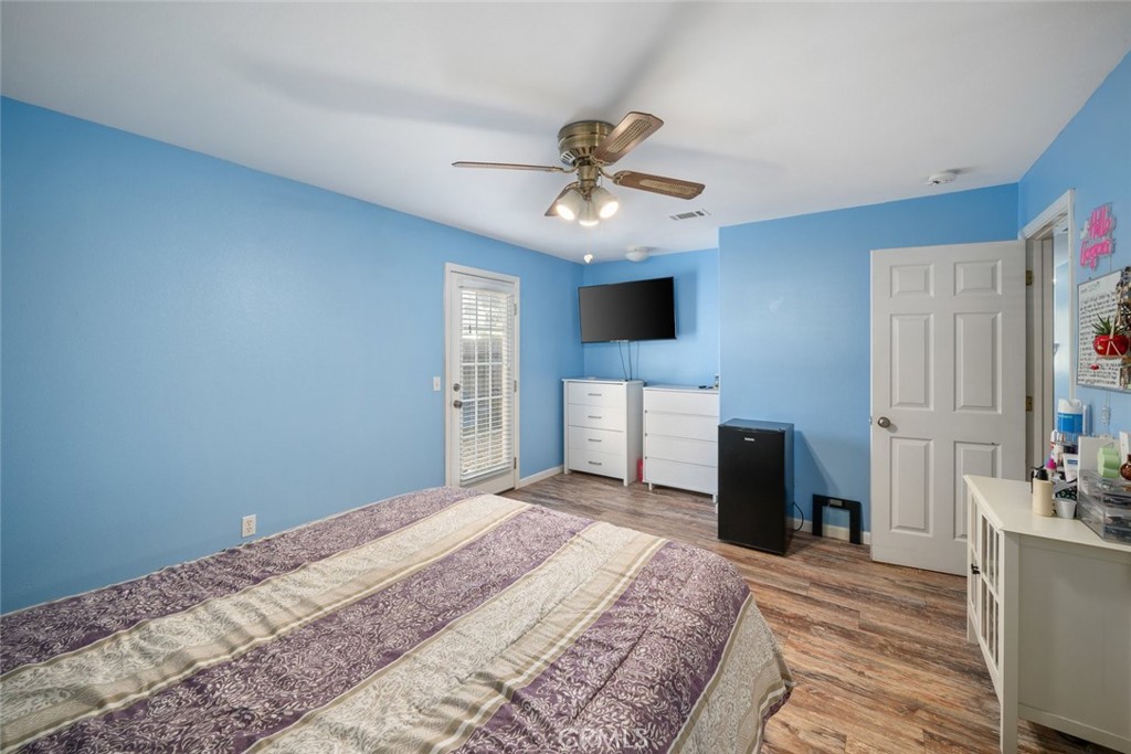 1681 Ocean Street Oceano, CA 93445 - Photo 13 of 25 a bedroom with a bed and a flat screen tv
