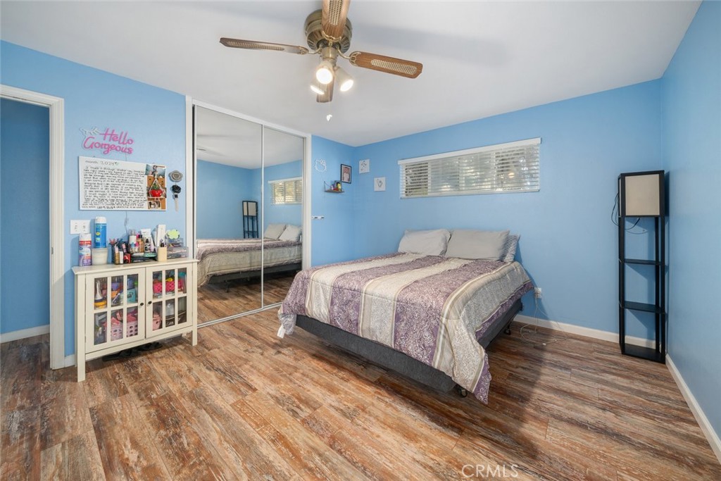 1681 Ocean Street Oceano, CA 93445 - Photo 14 of 25 a bedroom with a bed bookshelf and a window