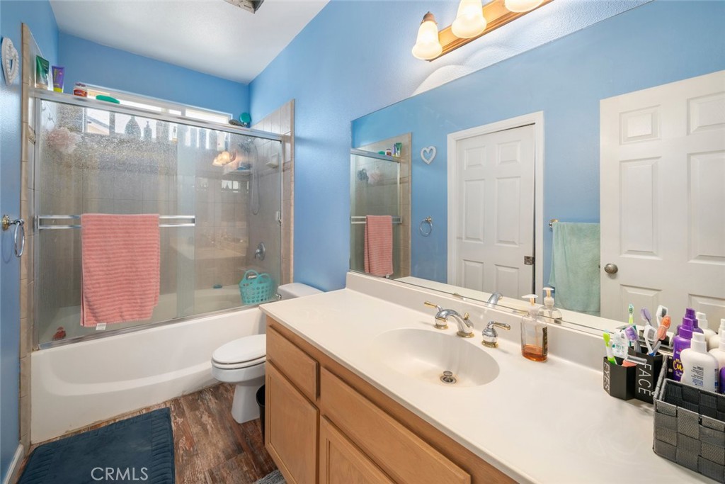 1681 Ocean Street Oceano, CA 93445 - Photo 18 of 25 a bathroom with a sink vanity mirror and toilet