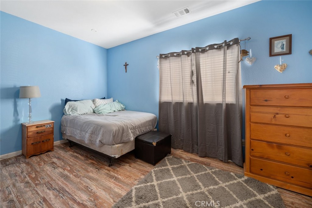 1681 Ocean Street Oceano, CA 93445 - Photo 19 of 25 a bedroom with a bed and a cabinets